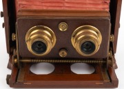 LANCASTER: "Stereo Instantograph" folding stereo camera, c. 1891, plate dimensions 8.5 x 17cm, twin Lancaster brass lenses with iris diaphragms, extremely scarce clip-on brass stereo shutter, red bellows. - 3