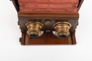 LANCASTER: "Stereo Instantograph" folding stereo camera, c. 1891, plate dimensions 8.5 x 17cm, twin Lancaster brass lenses with iris diaphragms, extremely scarce clip-on brass stereo shutter, red bellows. - 5