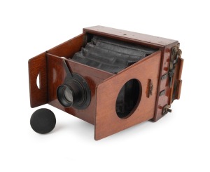 SHEW & CO.: Unusual "Xit" gate-struts camera, c. 1900, plate dimensions 11.5 x 16cm, Shew & Co. lens with iris diaphragm, leather lens cap.
