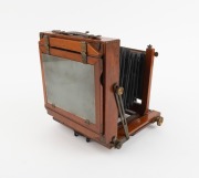 R.H. McBEAN EDINBURGH: Late-19th century view camera, plate dimensions 12 x 16.5cm, "Busch's Rapid Rectilinear F8" brass lens with iris diaphragm, Thornton-Pickard roller-blind shutter. - 2