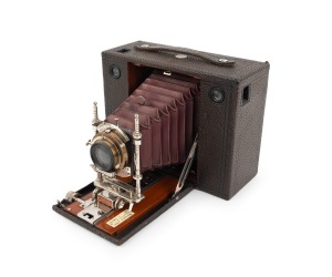 KODAK: No.4 Cartridge (Model E) folding camera, c. 1900, red bellows, pneumatic shutter.