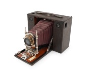 KODAK: No.4 Cartridge (Model E) folding camera, c. 1900, red bellows, pneumatic shutter.