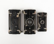 HOUGHTON: Group of c. 1910s strut-folding cameras, comprising Ensignette No. 1, Ensignette No.2, and Ensignette No. 2B De Luxe. (3 items) - 2