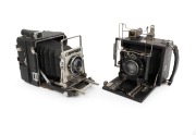 PRESS CAMERAS: Two c. 1940s examples, comprising side-handle Graflex Speed Graphic (plate dimensions 8.5 x 10.5cm/Optar 135mm f4.7/Wollensak Graphex shutter) and one of similar size (Rodenstock Doppel Anastigmat Eurynar 150mm f3.5 lens/Compur shutter).