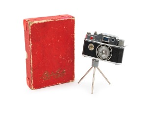 K.K.W.: Circa 1948 "Photolite Table Lighter" camera-shaped cigarette lighter, in seldom-seen original box; manufactured in Japan during the post-war occupation period. In working condition.