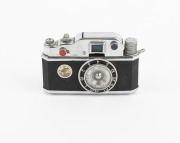 K.K.W.: Circa 1948 "Photolite Table Lighter" camera-shaped cigarette lighter, in seldom-seen original box; manufactured in Japan during the post-war occupation period. In working condition. - 2