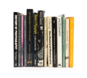 PHOTOGRAPHY BOOKS: A shelf of mostly hardcover books, late 20th century, focused on the history of the field. (14 items)