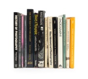PHOTOGRAPHY BOOKS: A shelf of mostly hardcover books, late 20th century, focused on the history of the field. (14 items)