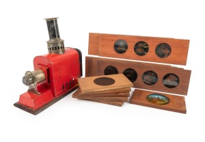 WOODEN SLIDES: Mid-19th century group comprising six numbered "Mammalia" panoramic slides and six smaller single-image slides (horse-riding/indigenous inhabitants content), together with a toy magic lantern in red. (13 items)