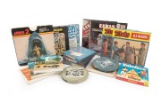 SUPER 8 FILM REELS: Group of ten 5" and five 7" film reels; titles include Elvis (4), Mickey Mouse, Jaws 2, Looney Tunes, Abbott & Costello, and others. (15 items)