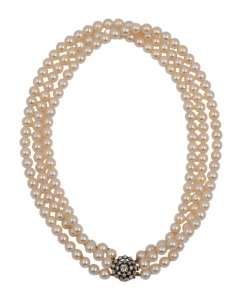 A vintage triple strand pearl choker necklace with yellow gold clasp adorned with a floret of rose cut white diamonds, early to mid 20th century, 42cm long, the clasp 1.5cm diameter.