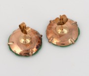 A pair of carved jade earrings, set in yellow gold, early 20th century, ​​​​​​​1.5cm diameter. - 2
