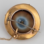 A fine quality antique 15ct yellow gold circular brooch adorned with an impressive carved banded agate, set with central pearl and finished in blue and white enamel around the border, mid 19th century, ​​​​​​​5cm diameter, 15.9 grams total. - 2