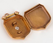An antique 15ct yellow gold shield shaped locket, set with a rose cut stone, 19th century, 3.3cm high, 10.2 grams. - 3