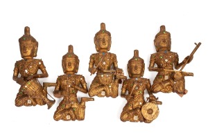 Set of five Thai carved gilt wood musical figures inlaid with coloured glass, mid 20th century, approximately 35cm high.