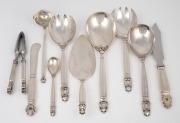 GEORG JENSEN "Acorn pattern" Danish silver serving utensils comprising of salad serving fork and spoon, large serving spoon and fork, gravy ladle, cake slice server, cake knife, large butter knife, jam spoon and nut crackers, (10 items), 530 grams silver 
