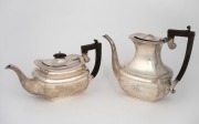An antique sterling silver coffee pot and a tea pot, with ebony handles and finial, made in Birmingham, circa 1911, (2 items), engraved with ownership initials, 1,328 grams total.