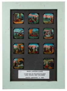 RELIGIOUS THEMES: A collection of 53 hand-illustrated glass slides for magic lantern; arranged across five different frames with glass backing, the largest 58 x 42cm overall.