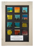 COMMUNITY SINGING SLIDES: A framed display of 12 hand-illustrated glass slides for magic lantern, titles include "All the Nice Girls Love a Sailor", "Sons of the Sea", and "In a Shanty in Old Shanty Town"; glass backing for illumination, 60.5 x 42.5cm ove