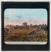 A collection of 83 x 83mm photographic glass slides for magic lantern, many hand-tinted, including many World War I views (British Whippet tank charge, burning of piles of German war dead, King George V touring ordnance factory). (100+ items) - 4