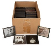 A collection of 83 x 83mm photographic glass slides for magic lantern, many hand-tinted; mostly churches (Westminster Abbey) and cities (New York). (130+ items)
