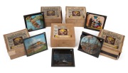 INDCOL COLOURED OPTICAL LANTERN SLIDES: Group of sets of glass slides for magic lantern, each set comprising twelve 83 x 83mm slides, the titles being "Airships & Aeroplanes", "Life in Africa", "The Emigrant's Voyage", "Jack's Treasure", and "Goldilocks a