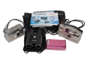 Diverse group comprising Olympus RC II WP binoculars (with bag), Pentax Optio 430 RS, Pentax PC-33, Sony DSC-T90, plus some ephemera and two camera cases. (qty.)