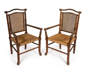 A pair of antique English beech armchairs in the Japanese style, 19th/20th century, 103cm high, 67cm across the arms.