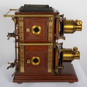 BIUNIAL MAGIC LANTERN: Large c. 1880s mahogany and brass example with impressive quadruple-extension lens barrels, tin chimney element, limelight burner apparatus, four side-opening doors with red or blue peepholes, together with two condenser lenses and - 3