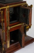 BIUNIAL MAGIC LANTERN: Large c. 1880s mahogany and brass example with impressive quadruple-extension lens barrels, tin chimney element, limelight burner apparatus, four side-opening doors with red or blue peepholes, together with two condenser lenses and - 5