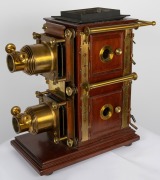 BIUNIAL MAGIC LANTERN: Large c. 1880s mahogany and brass example with impressive quadruple-extension lens barrels, tin chimney element, limelight burner apparatus, four side-opening doors with red or blue peepholes, together with two condenser lenses and - 6