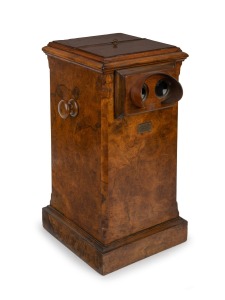 Late-19th century tabletop stereoscope, hand-operated slide magazine loaded with 50 stereo cards (abolition of slavery, paddlesteamer, railways, risqu&eacute; types), "Abraham & Co. Opticians Liverpool" retailer's plate; dimensions 52 x 27 x 29cm.