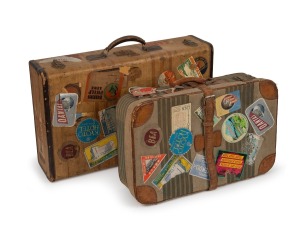 Two vintage suitcases, each attractively adorned with various travel labels including QANTAS and A.N.A., mid 20th century, originally the property of an Australian air hostess, 60cm and 70cm wide.