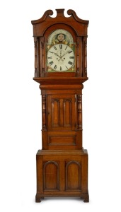 An antique Welsh mahogany longcase clock, signed "P. D. Pierce, Pwllheli". Decorated with recessed arcaded panels and turned columns either side of the small trunk door, swan neck pedament to the sliding hood with fully turned and split column decoration to the break arch door. Painted break arch dial plate with rolling moon phase, fretted and stamp decorated brass hands, Roman numerals and minute track plus seconds subsidiary and date aperture arch. Eight day time and bell striking movement. Co