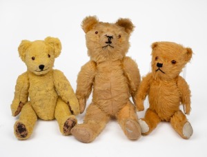 Three assorted vintage English teddy bears, including one straw filled example, 20th century, the largest 41cm high.