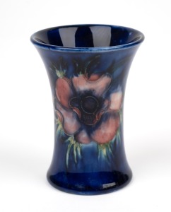 MOORCROFT "Anemone" English pottery miniature spill vase on blue ground, impressed "Moorcroft, Made In England" with blue signature mark, 9cm high.