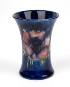 MOORCROFT "Anemone" English pottery miniature spill vase on blue ground, impressed "Moorcroft, Made In England" with blue signature mark, 9cm high.