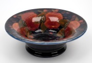 MOORCROFT "Pomegranate" English pottery bowl on blue ground, impressed "Moorcroft, Made In England", 7cm high, 20.5cm diameter.