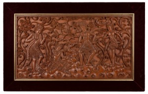 A vintage ornate carved teak South-East Asian panel in plush velvet frame, mid 20th century, 61 x 76cm overall.