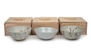 BINH THUAN SHIPWRECK group of three Chinese porcelain bowls, late Ming, circa 1600, housed in bespoke timber boxes with Christies labels and branding, 9cm high, 20cm diameter each.