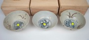 BINH THUAN SHIPWRECK group of three Chinese porcelain bowls, late Ming, circa 1600, housed in bespoke timber boxes with Christies labels and branding, 9cm high, 20cm diameter each. - 2