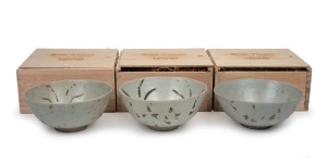BINH THUAN SHIPWRECK group of three Chinese porcelain bowls, late Ming, circa 1600, housed in bespoke timber boxes with Christies labels and branding, 9cm high, 20cm diameter each.