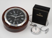 OMEGA "Nautic-Star" desk clock with quartz movement and date aperture, in sectional mahogany case; together with an OMEGA stopwatch with safety chain in nickel plated case and original box of issue with instructions, (2 items), the desk clock 14cm across 