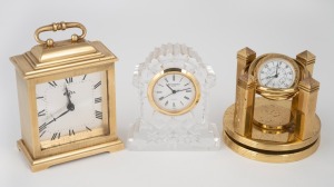 Three assorted desk top time pieces, including WATERFORD CRYSTAL quartz, a SWIZA Swiss made eight day clock in brass case in the form of a English bracket clock with alarm and a CITIZEN quartz gimble mounted desk watch in revolving brass case, (3 items), the Swiza 10cm high handle up.