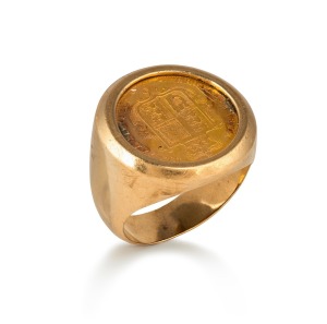 An 1875 English 22ct gold sovereign, mounted as a signet ring in 9ct gold, 14.7 grams total.