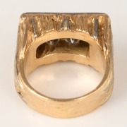 An imposing 18ct gold gents ring, set with eight large brilliant cut white diamonds, mid to late 20th century, stamped "18ct", 28.4 grams total. - 2