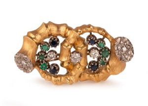 LEO AMMAVUTA stunning Australian design and manufactured 18ct yellow gold brooch, adorned with diamonds, emeralds and sapphires in 18ct white gold mounts, late 20th century, 5cm wide, an impressive 34 grams total.
