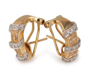 A pair of vintage 18ct gold earrings, set with assorted brilliant cut diamonds in white gold mounts, stamped "750 C.S.L.", 7 grams total.