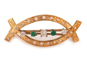 A vintage 18ct gold brooch, adorned with two emeralds and assorted brilliant and emerald cut white diamonds, stamped "18ct", 5cm wide, 7.5 grams total.