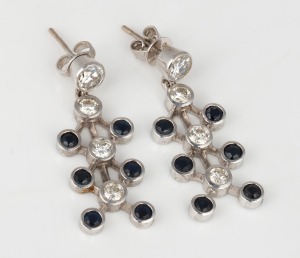 A pair of 18ct white gold diamond and sapphire earrings, 8.3 grams total.